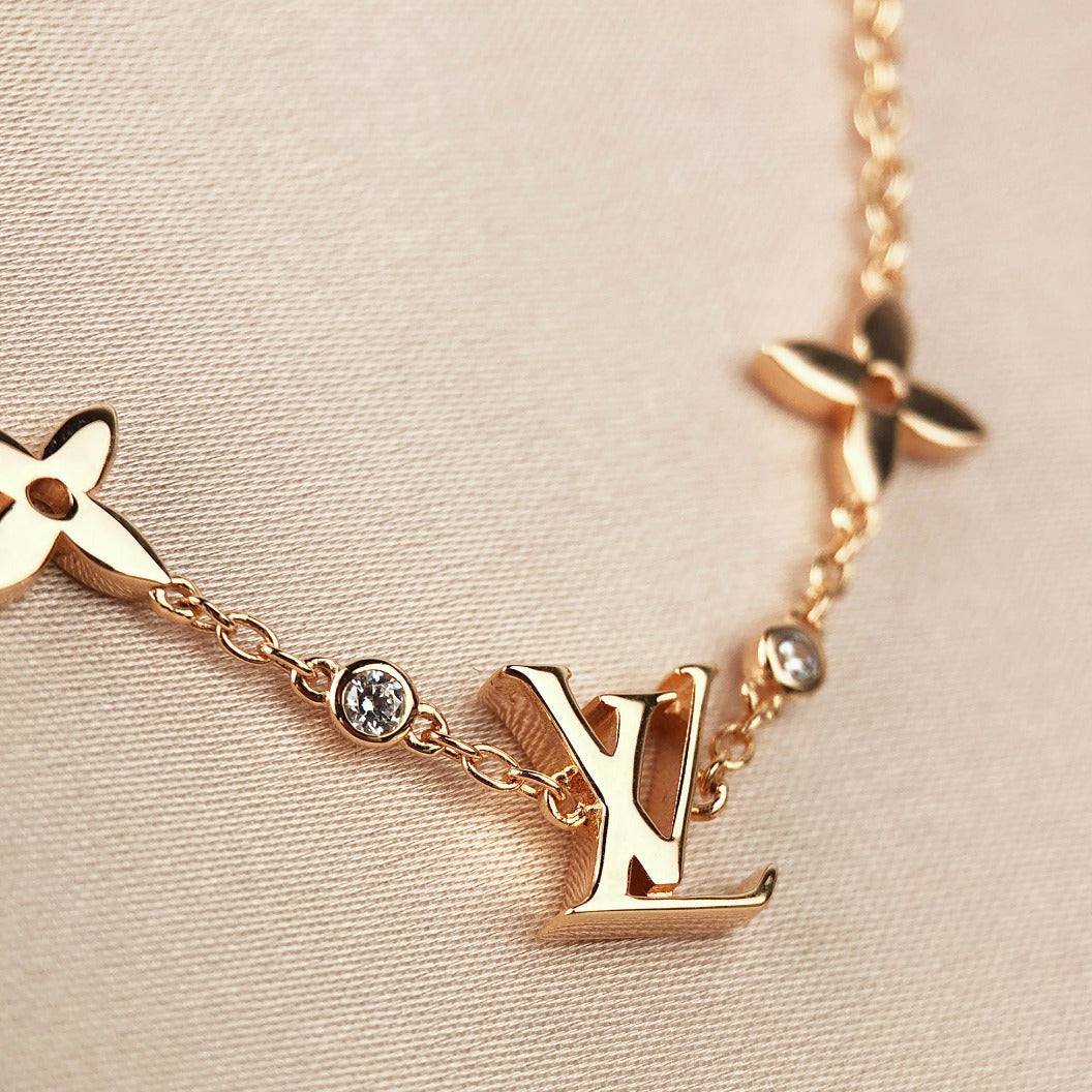 LOUIS VUITTON STAR AND SUN 7 MOTIFS GOLD BRACELET